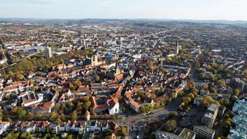 Aerial view of a city with dense buildings.