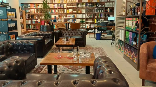 Leather couches in a whisky shop lounge.