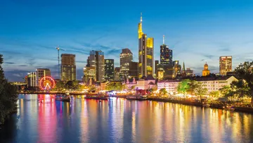 Frankfurt skyline at night with river reflections.