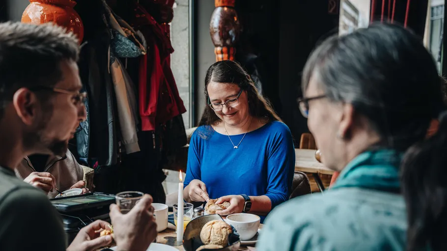 People enjoying a meal in a cozy café.