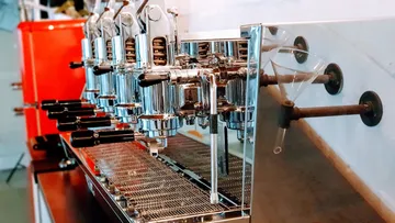 Commercial espresso machine in a coffee shop.