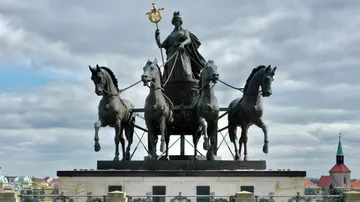 Bronze quadriga statue on a historical gate.