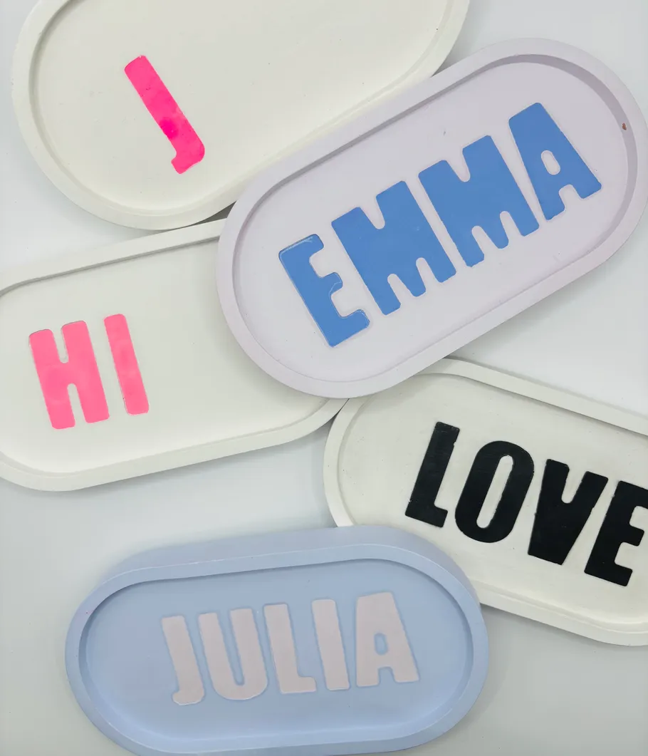 Colorful name signs on overlapping trays.