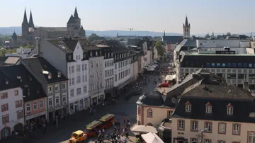 Historic town square with old buildings and church.