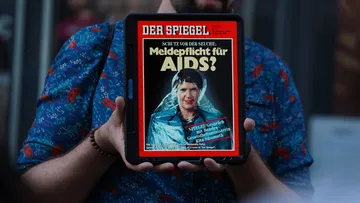 Tablet displaying Der Spiegel AIDS cover.