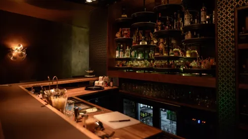 Elegant bar interior with dim lighting.