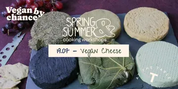 Various vegan cheeses on a slate board.