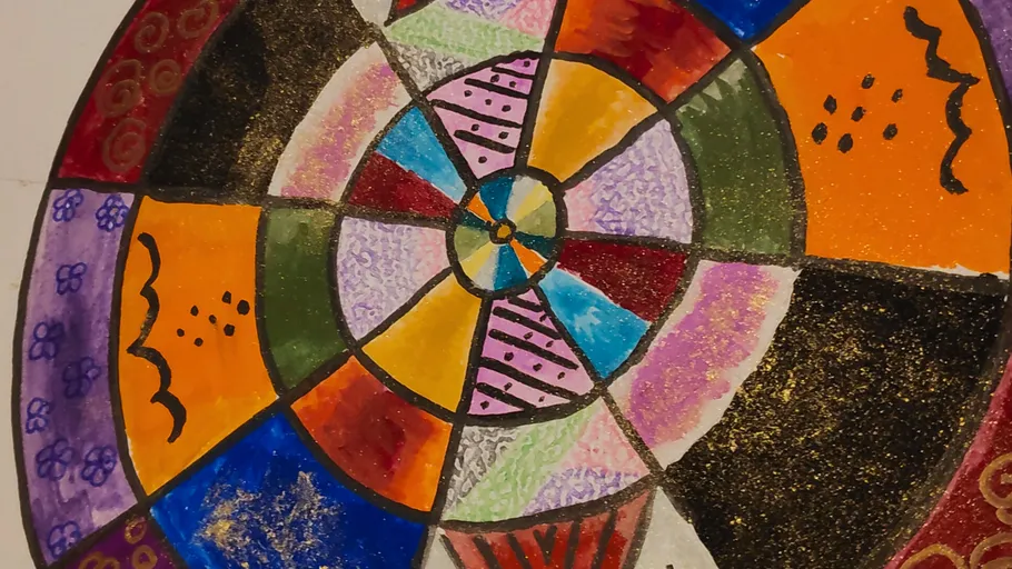 Colorful mandala drawing with geometric patterns.
