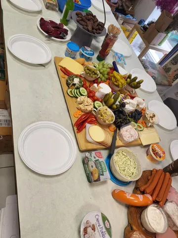 Table with a variety of snacks and appetizers.