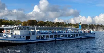 Boat cruising on a sunny lake.