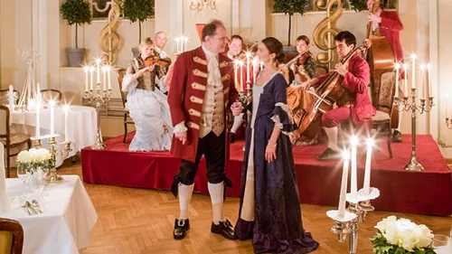People in historical costumes at a musical performance.