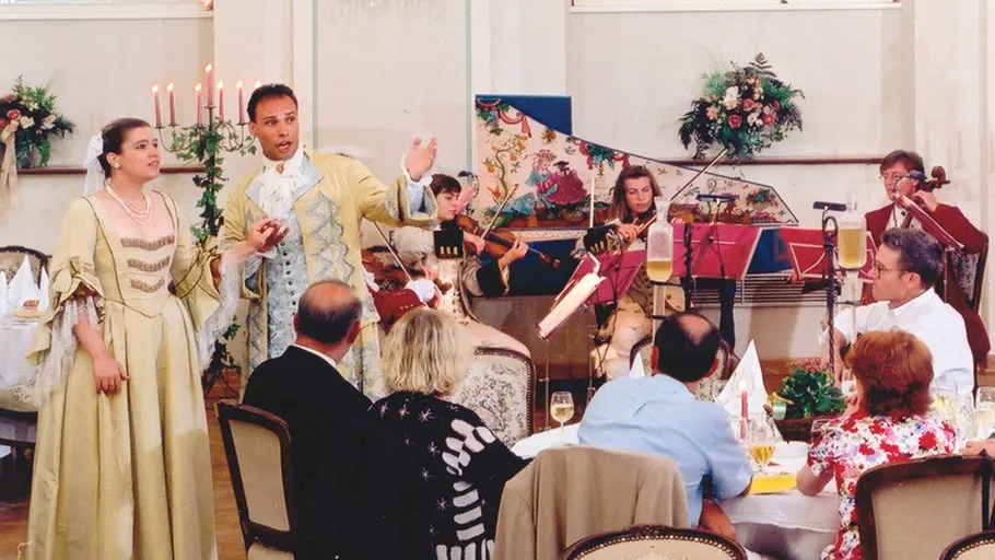 Singers and musicians perform at a formal event.