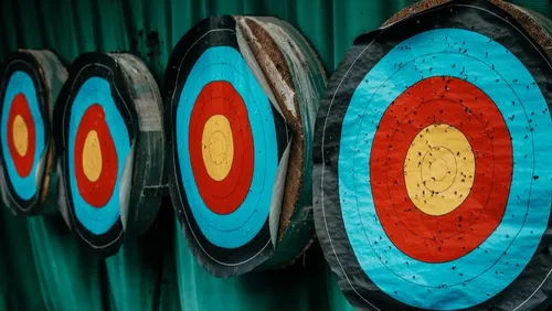 Four colorful archery targets in a row.