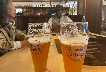 Two beers on table in a pub.