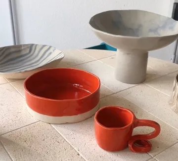 Colorful ceramics on a tiled table.