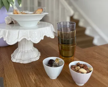 Glasses and bowls on a wooden table.