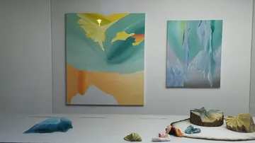 Gallery showing abstract paintings and sculptures.