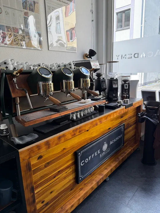 Espresso machine on wooden counter in coffee shop.