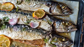 Three baked fish with lemon and herbs.