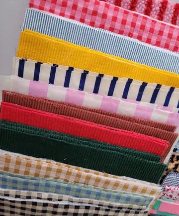 Colorful fabric swatches arranged vertically.