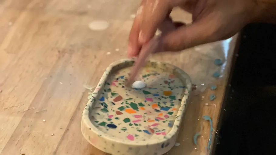 Hand crafting a colorful terrazzo tray.