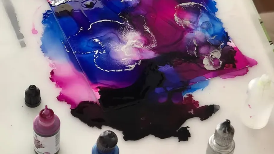 Vibrant ink art with bottles on table.