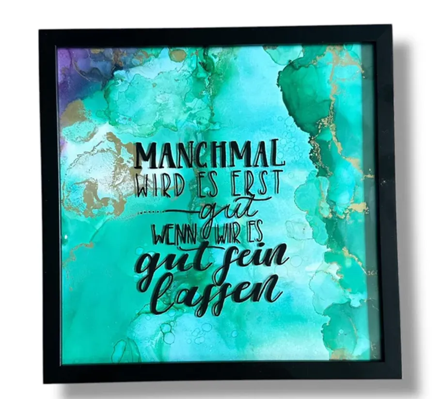 Framed quote on teal abstract background.