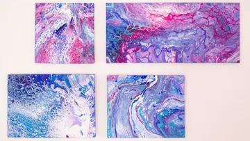 Abstract paintings with blue and pink swirls.