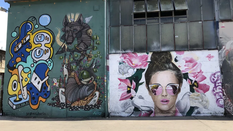 Colorful street art on building wall.
