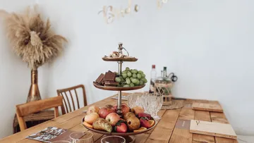 Fruit and pastries on a wooden table.