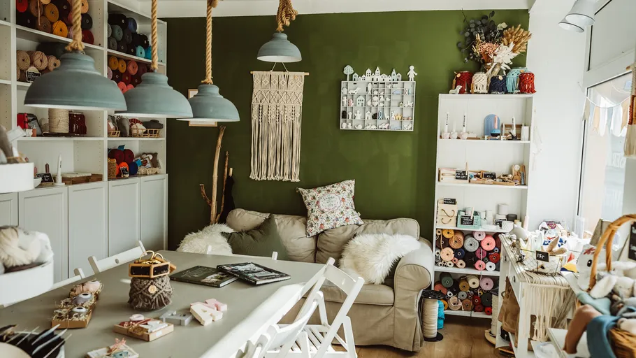 Craft room with yarn and a sofa.