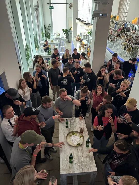 Group of people drinking in a modern bar.