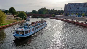 Tour boat cruising on a city canal.
