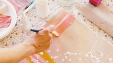 Hand painting with brush on paper.