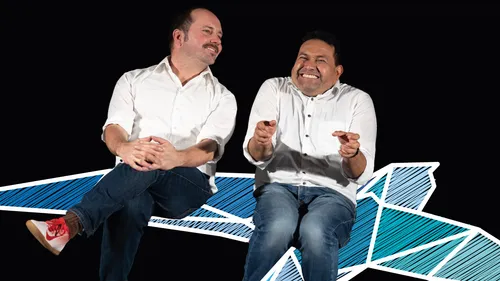 Two men sitting on a drawn airplane.