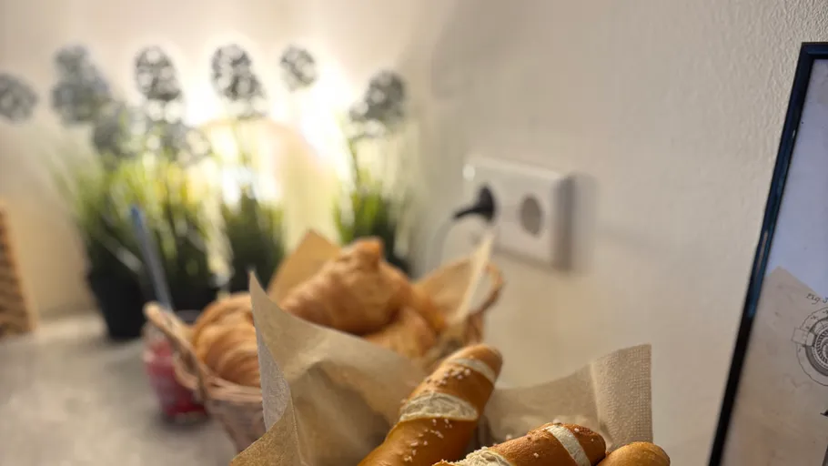 Basket of pretzels on a kitchen counter.