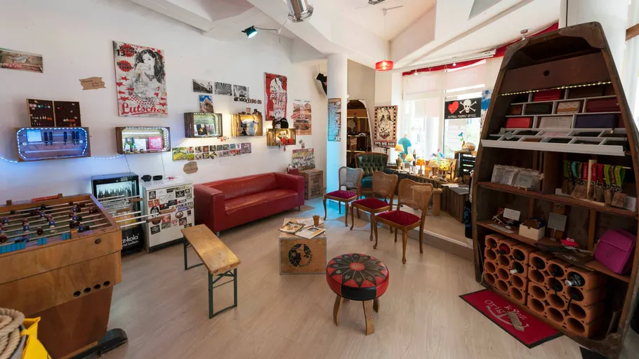 Eclectic room with vintage decor and seating.