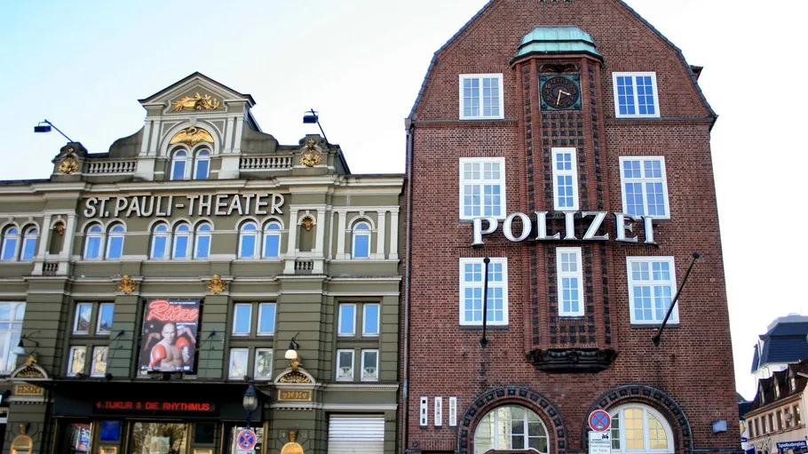 Two historic buildings with theater and police signs.