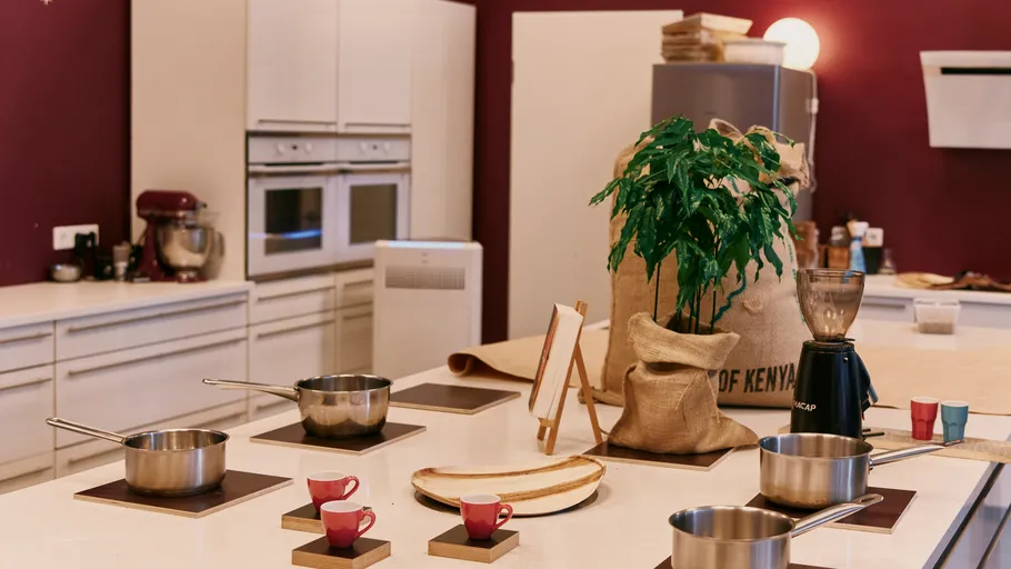 Modern kitchen with cooking pots and decor.