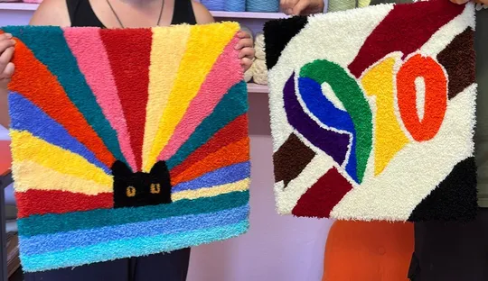Two colorful rugs with abstract patterns displayed.