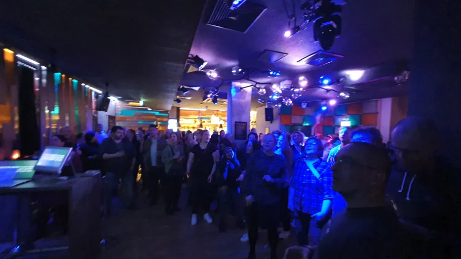 Crowd enjoying music in nightclub.