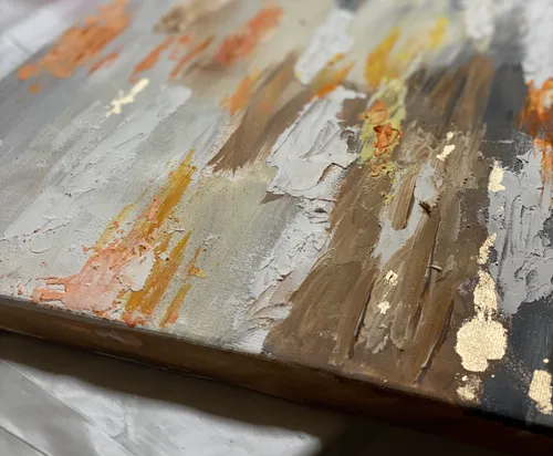 Abstract textured painting, earthy tones, close-up view.