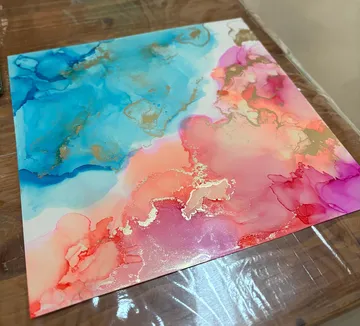 Abstract painting with vibrant blue, pink colors.