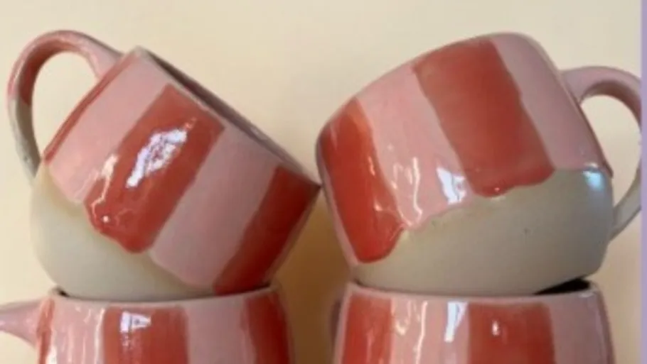 Four cups stacked with red stripes.
