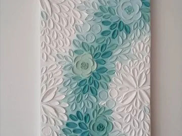 Floral relief art with blue and white flowers.