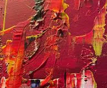 Colorful abstract paint texture with red hues.