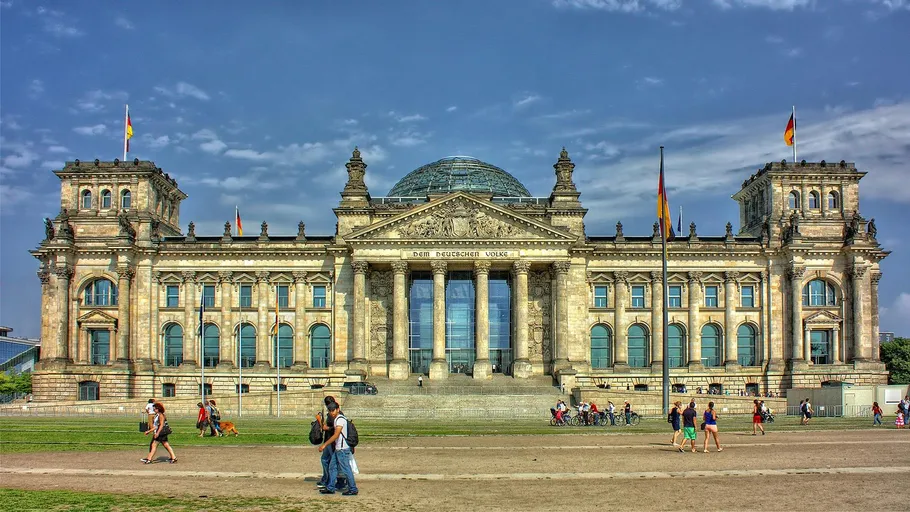 People walking near the German Reichstag building.