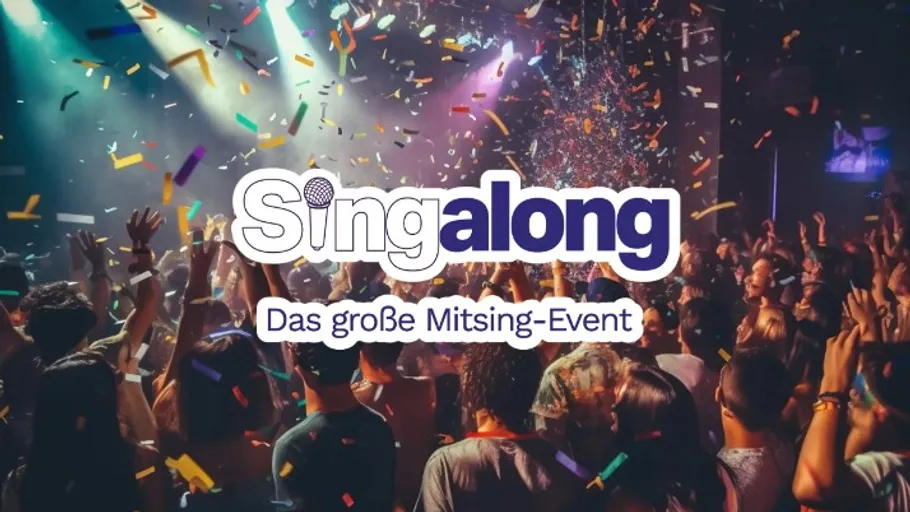 Crowd cheering with stage lighting and confetti.