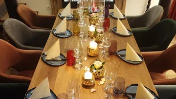 Elegant table setting with candles and napkins.
