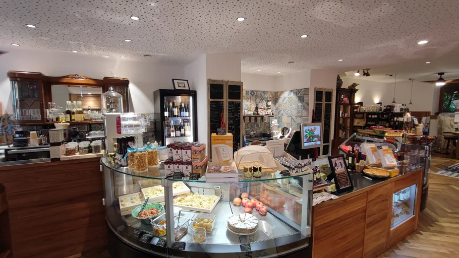 Gourmet shop interior with food displays.